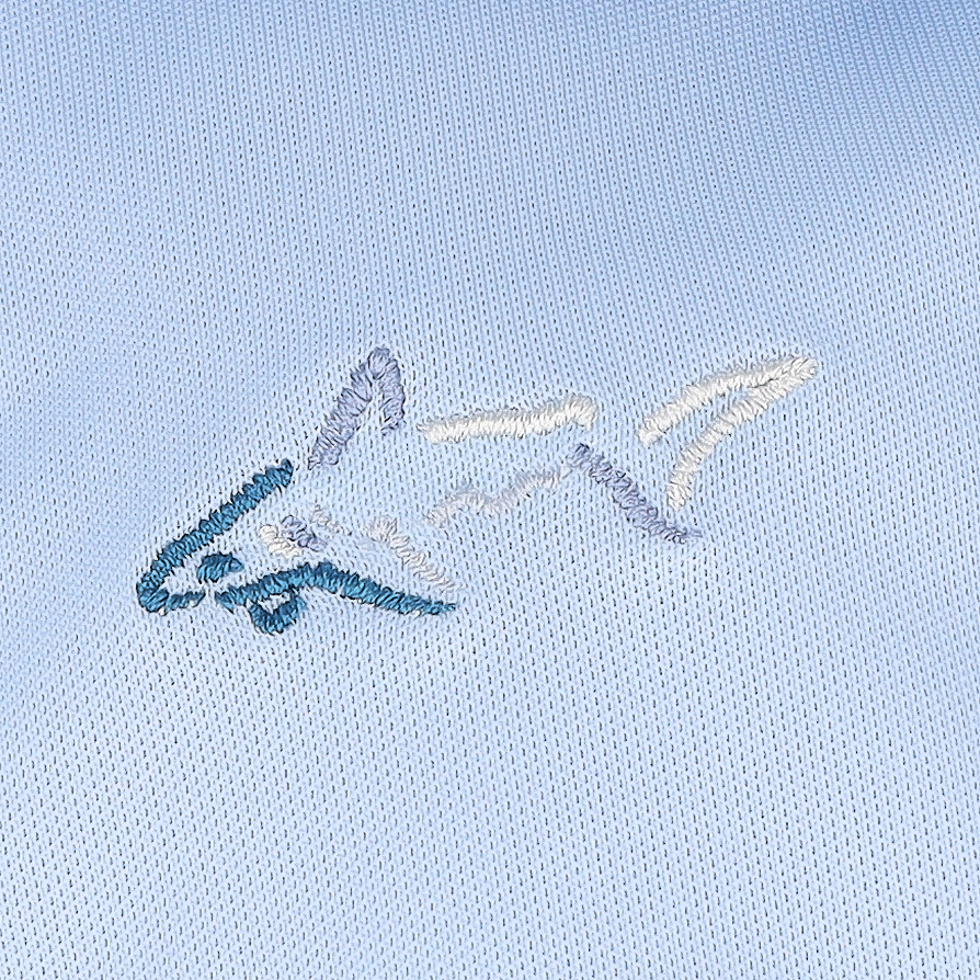 Camisa polo Greg Norman Freedom Micro Piqué azul neblina para hombre - Imagen 14 de 15